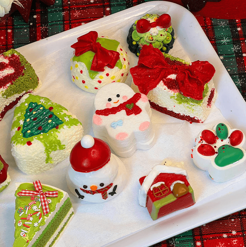 Christmas PU squishy toy assortment with snowman tree wreath bow cake house and paw designs