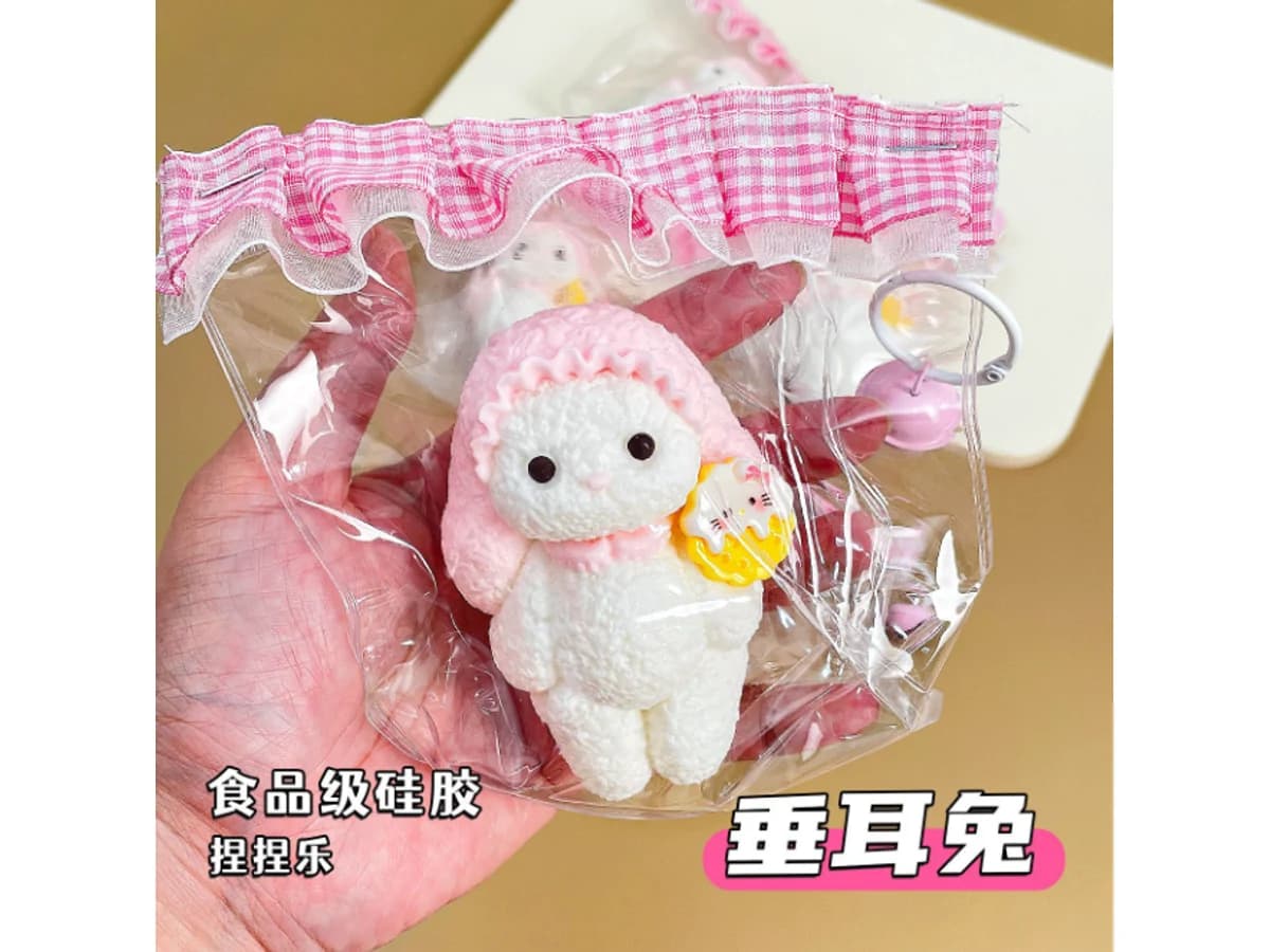 Pink rabbit silicone squishy reference in an individual clear presentation bag