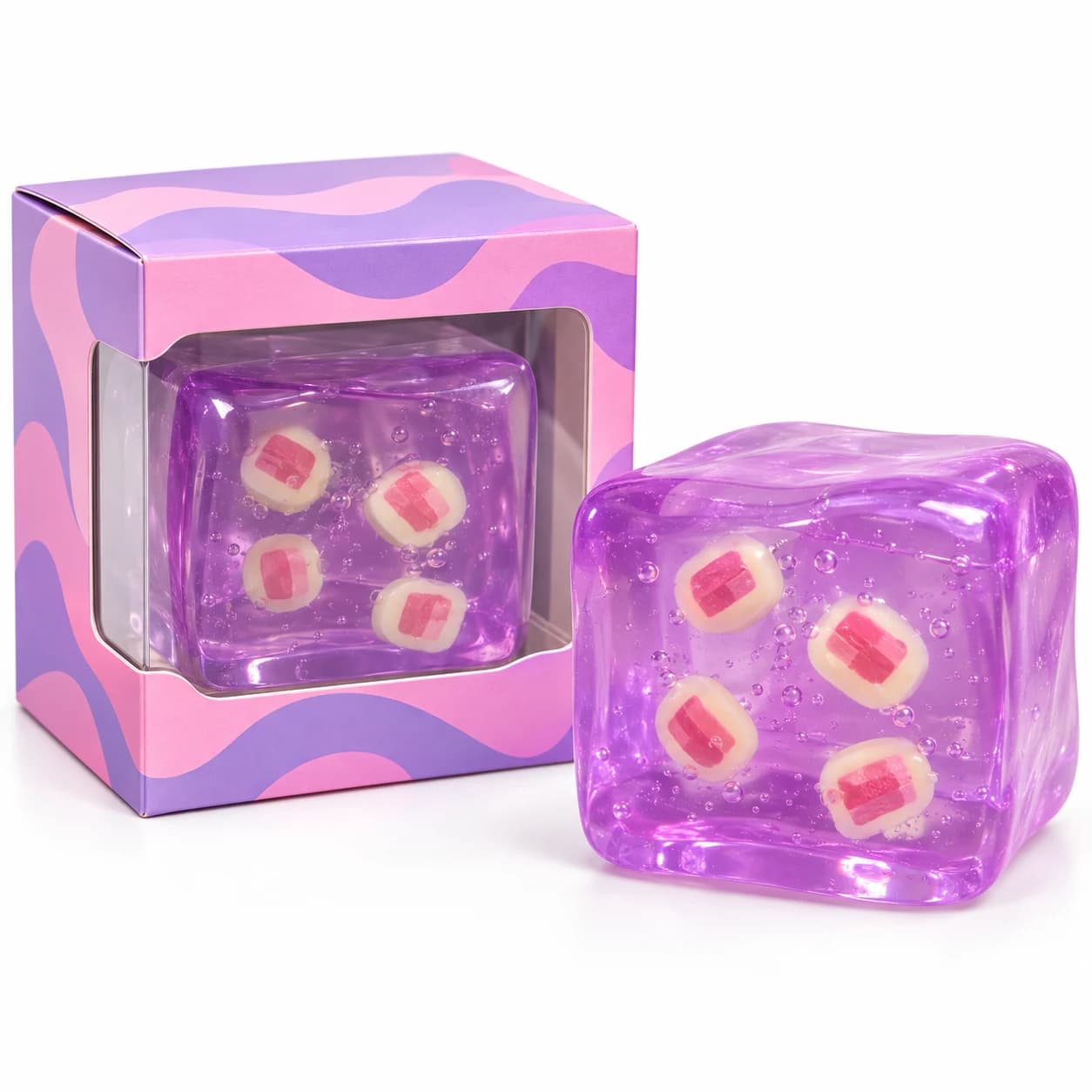 Translucent purple TPR squishy cube with custom plastic inserts beside a pink and purple window box