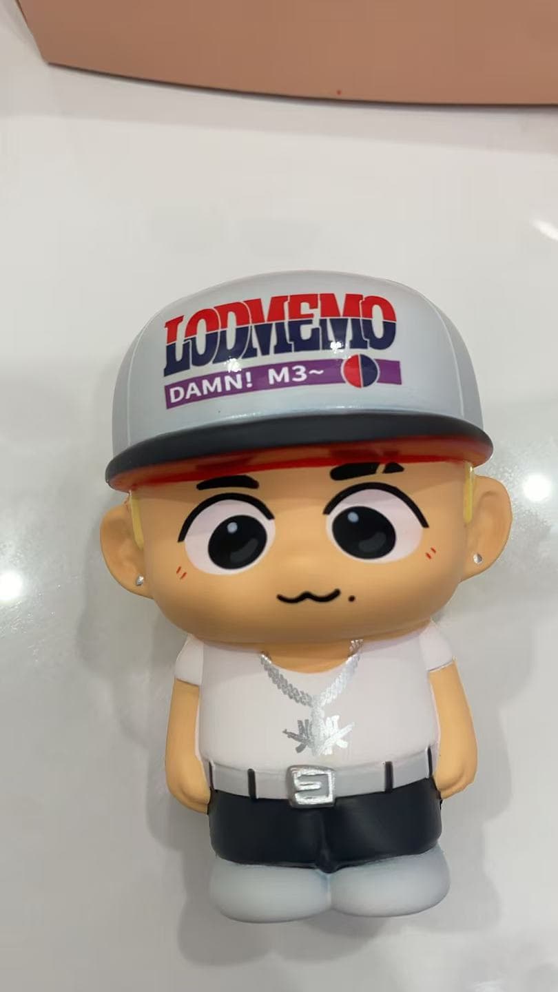 Custom PU character figure with a gray printed cap, expressive eyes, white shirt, black trousers and silver-tone details
