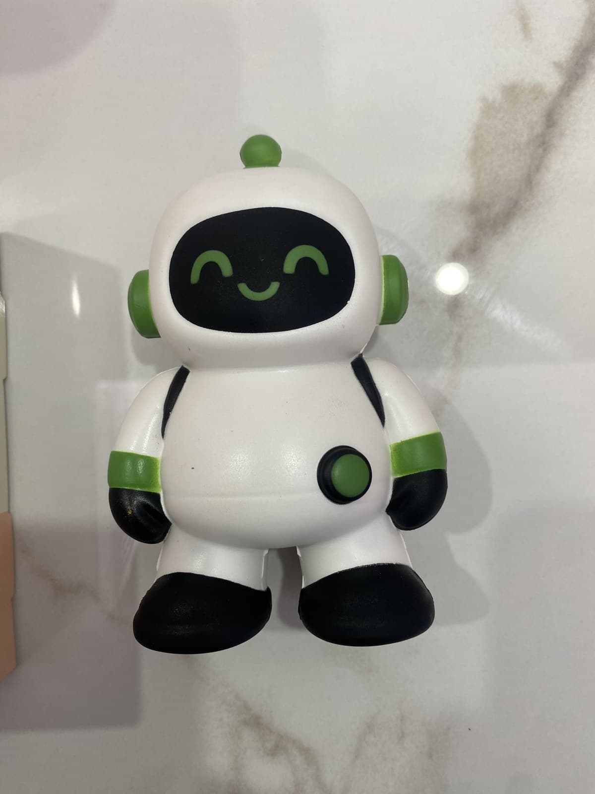 Custom white PU robot mascot with a black smiling face, green accents and black boots